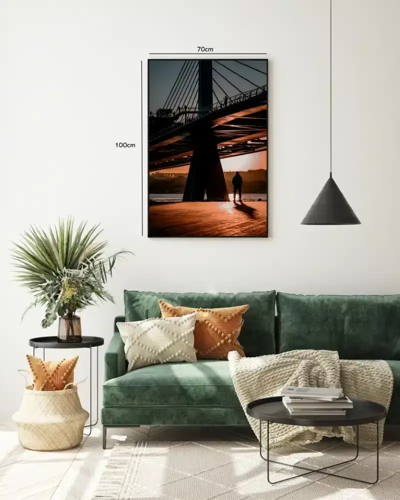 Silhouetted Figure Under Bridge