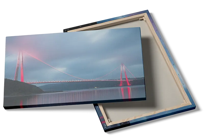 Illuminated Suspension Bridge At Dusk