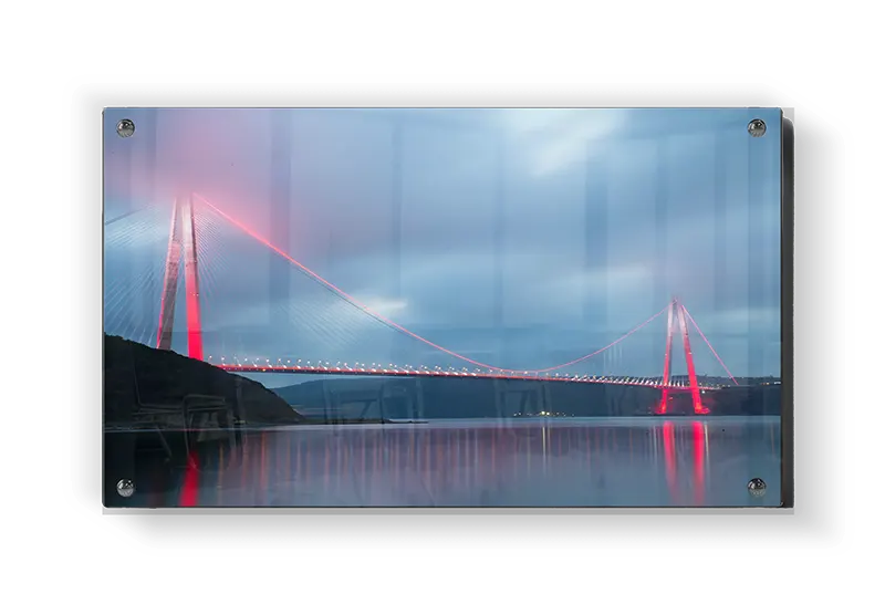 Illuminated Suspension Bridge At Dusk